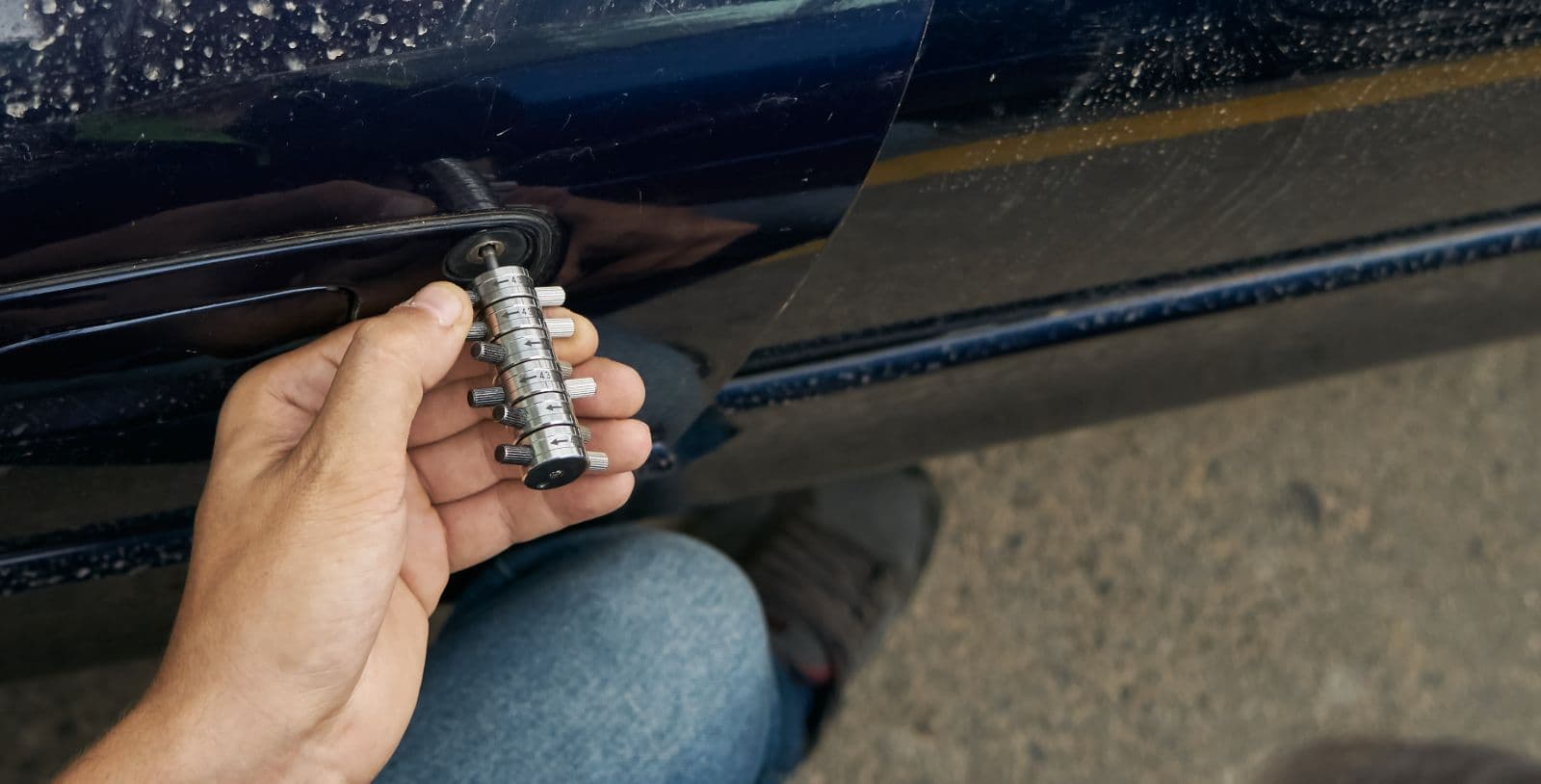 Locksmith working on a car lock